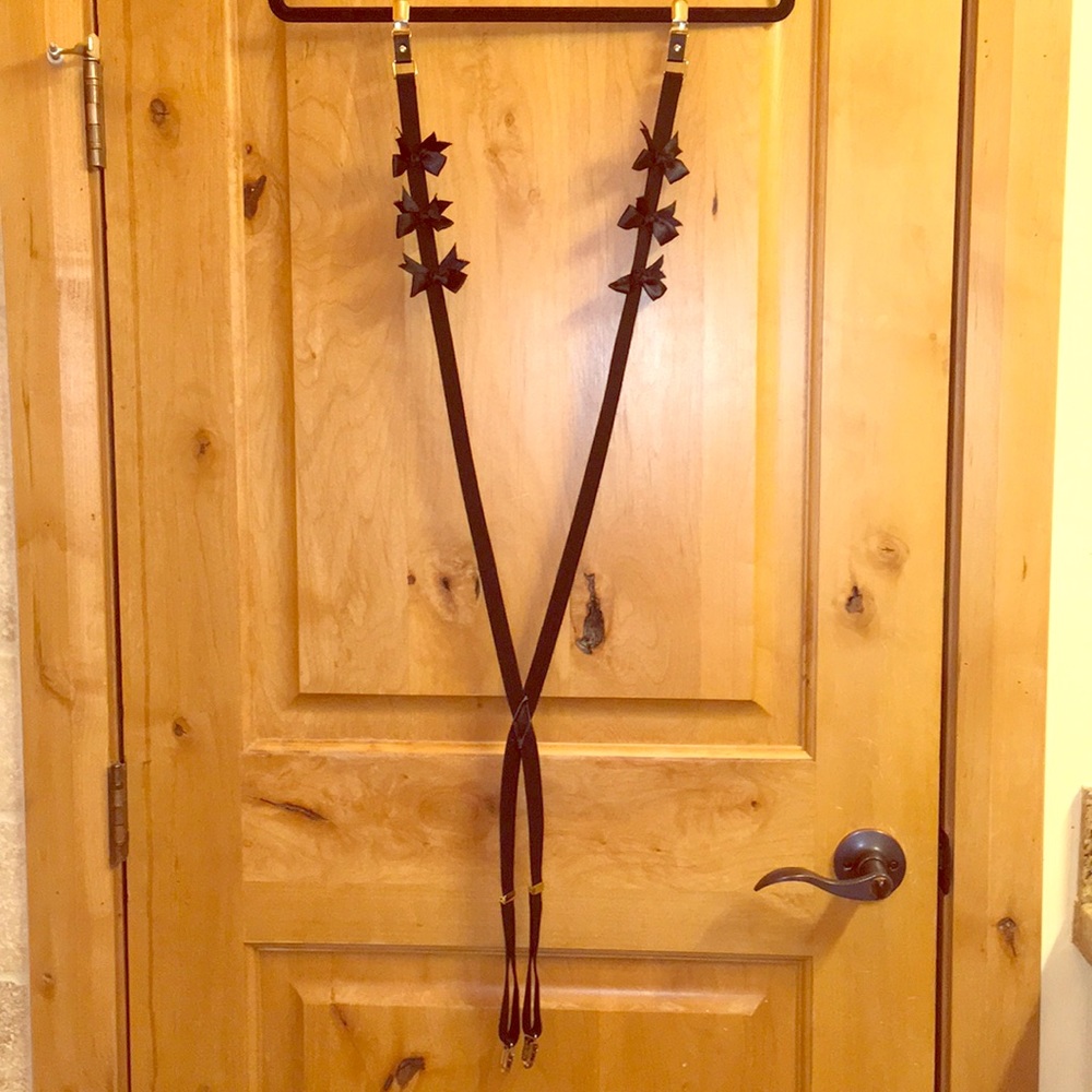 Black suspenders with black silk bows